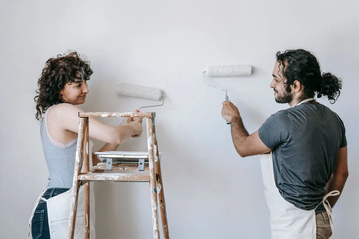People painting a wall together — painting help in Chattanooga